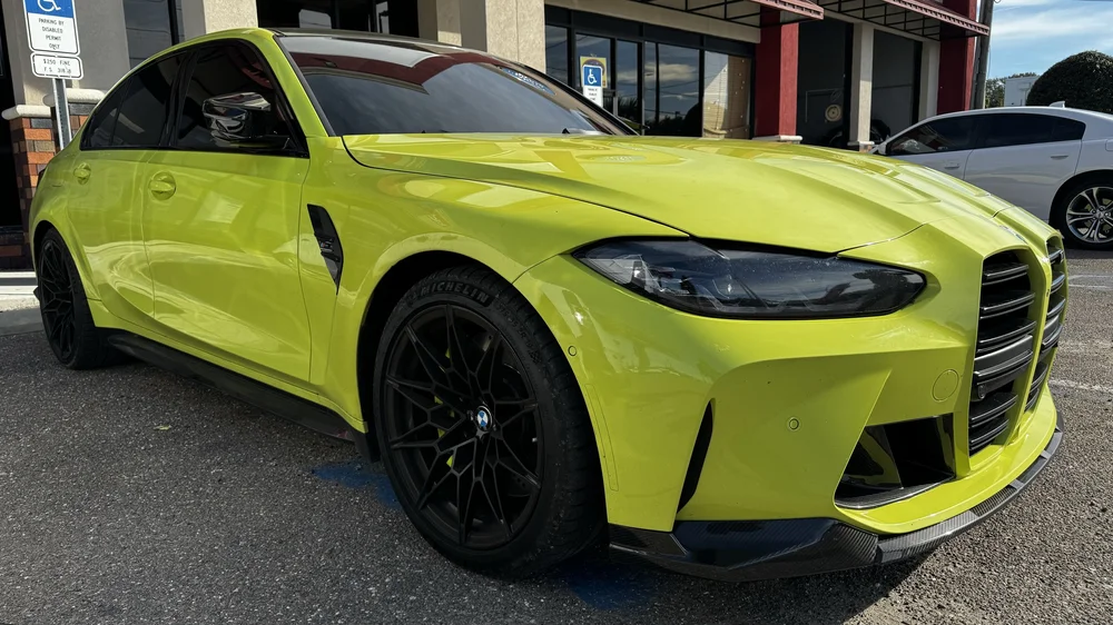 Green BMW M4 ceramic coated by The White Glove Detailer in Tampa Bay