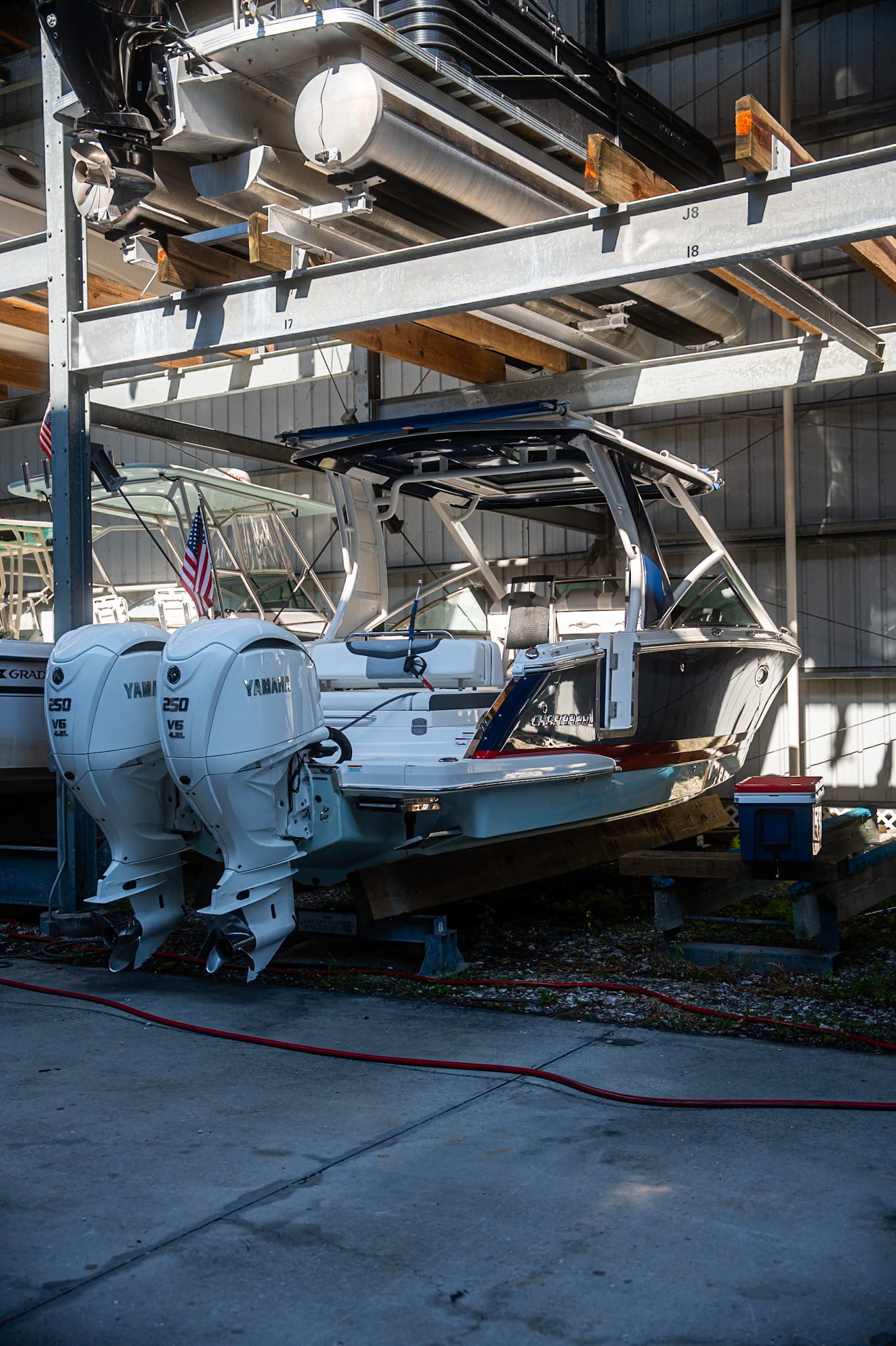 Center console boat with triple outboard motors ready for marine detailing in Tampa Bay