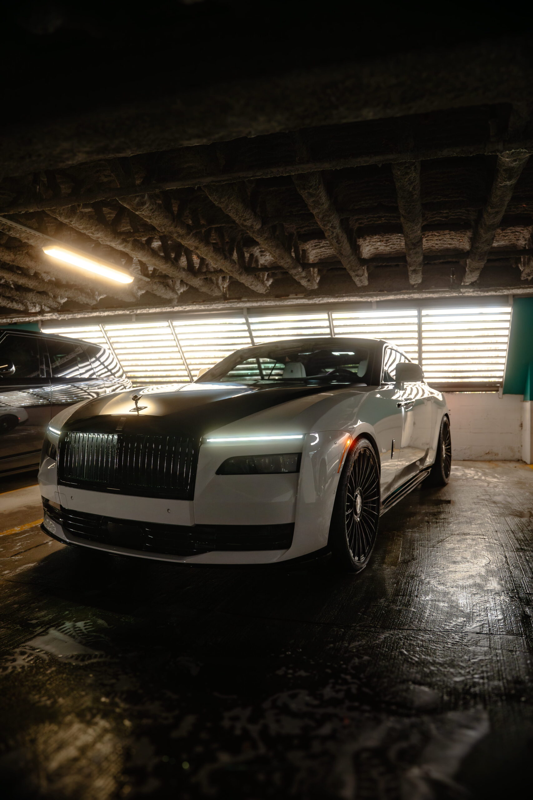 Rolls-Royce Spectre with a ceramic coated gloss finish in a Tampa parking garage
