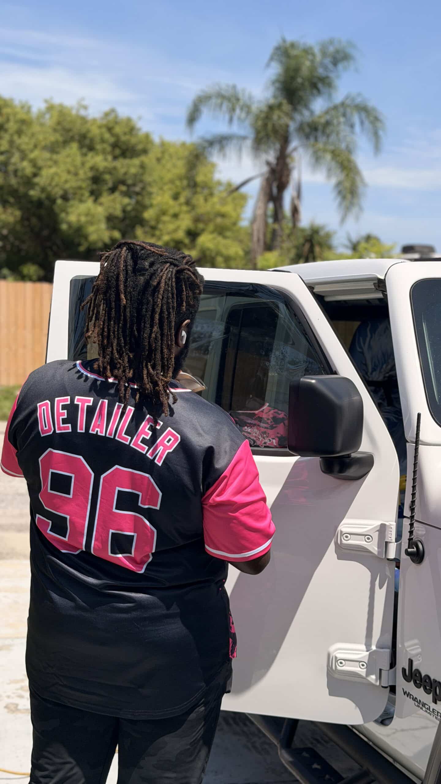 White Glove Detailer team member at the mobile detailing van in Tampa FL